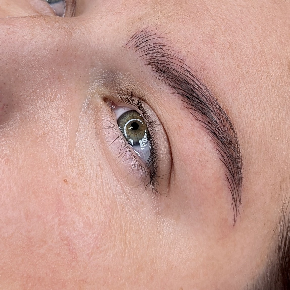Microblading eyebrow result, fine hair-stroke detail